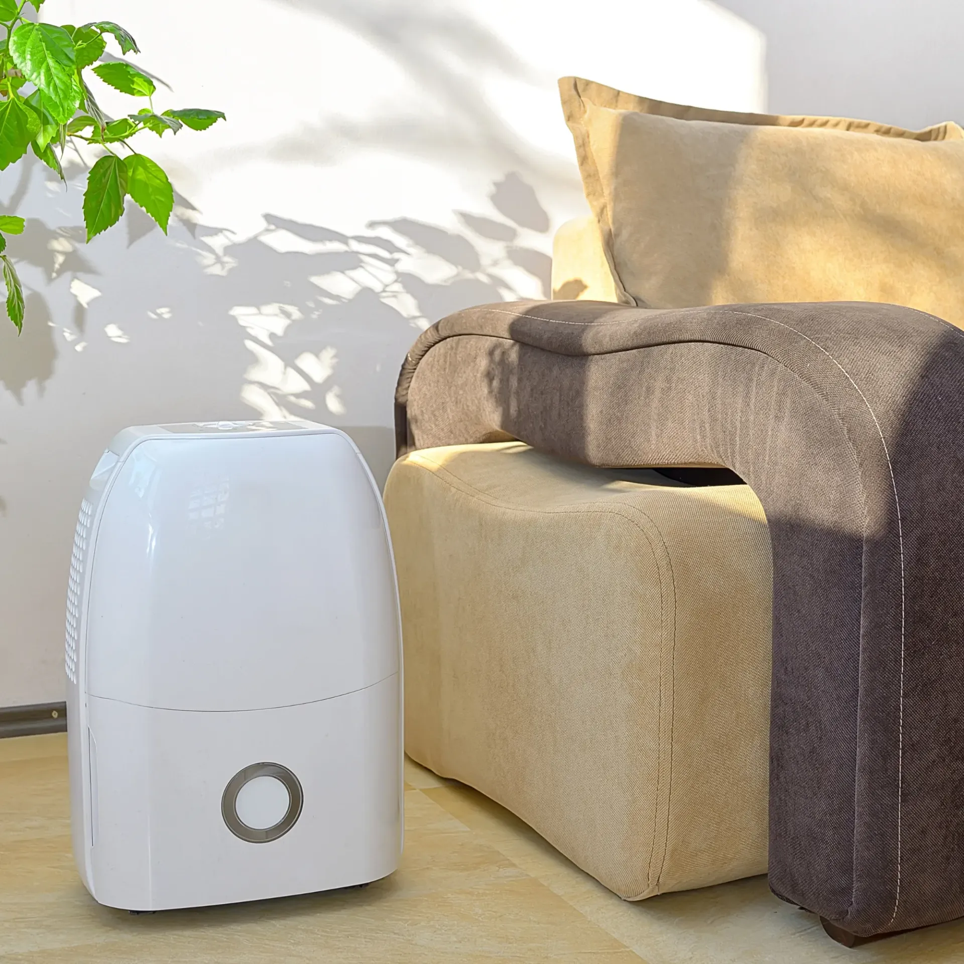 Comfort Air Solution LLC - A dehumidifier is sitting next to a couch in a living room