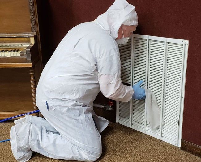 Man Cleaning Up Molds