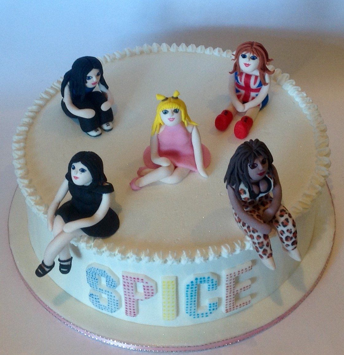 Girl band cake with hand made figures and royal icing created by A Cherry On Top, Isle of Wight.