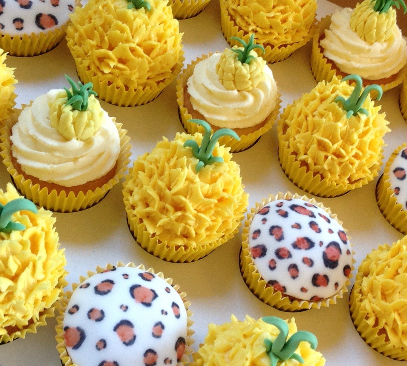 24 pineapple and leopard animal print cupcakes created by A Cherry On Top, Isle of Wight.