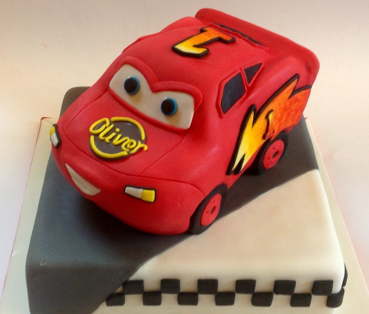 3D racing car fondant birthday cake created by A Cherry On Top, Isle of Wight.