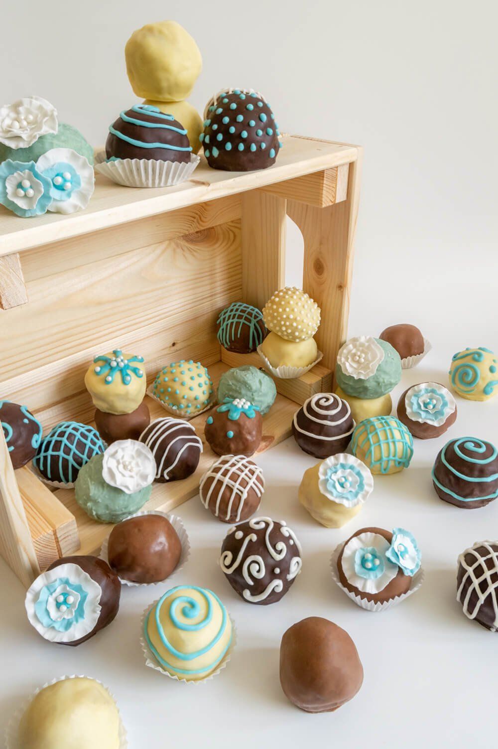 Chocolate cake bites for weddings with blue and white created by A Cherry On Top, Isle of Wight. Photograph by Mooksgoo