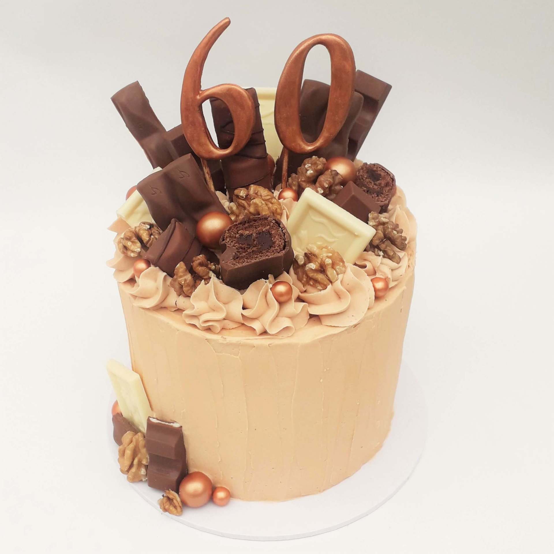 Coffee buttercream cake with chocolate toppings. Created by A Cherry On Top, Isle of Wight.