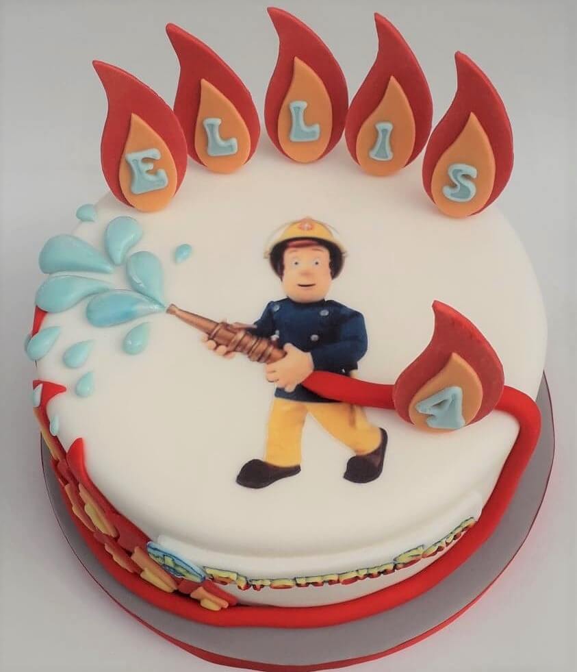 Fireman Sam Cake with hose and flames. Created by A Cherry On Top.