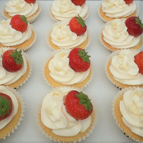 Strawberry and White Chocolate flavour cupcakes. Produced by A Cherry On Top