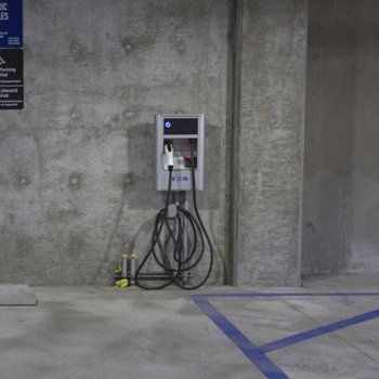 Electric vehicle parking space and charging station