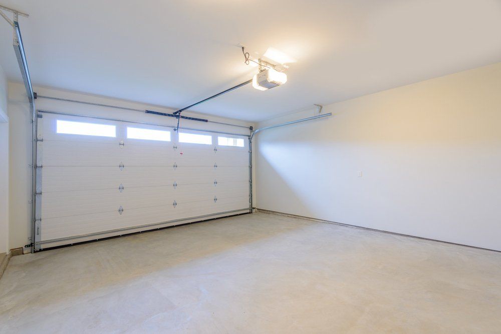 Home Exterior with White Double Garage — Garage Doors in Wollongong, NSW
