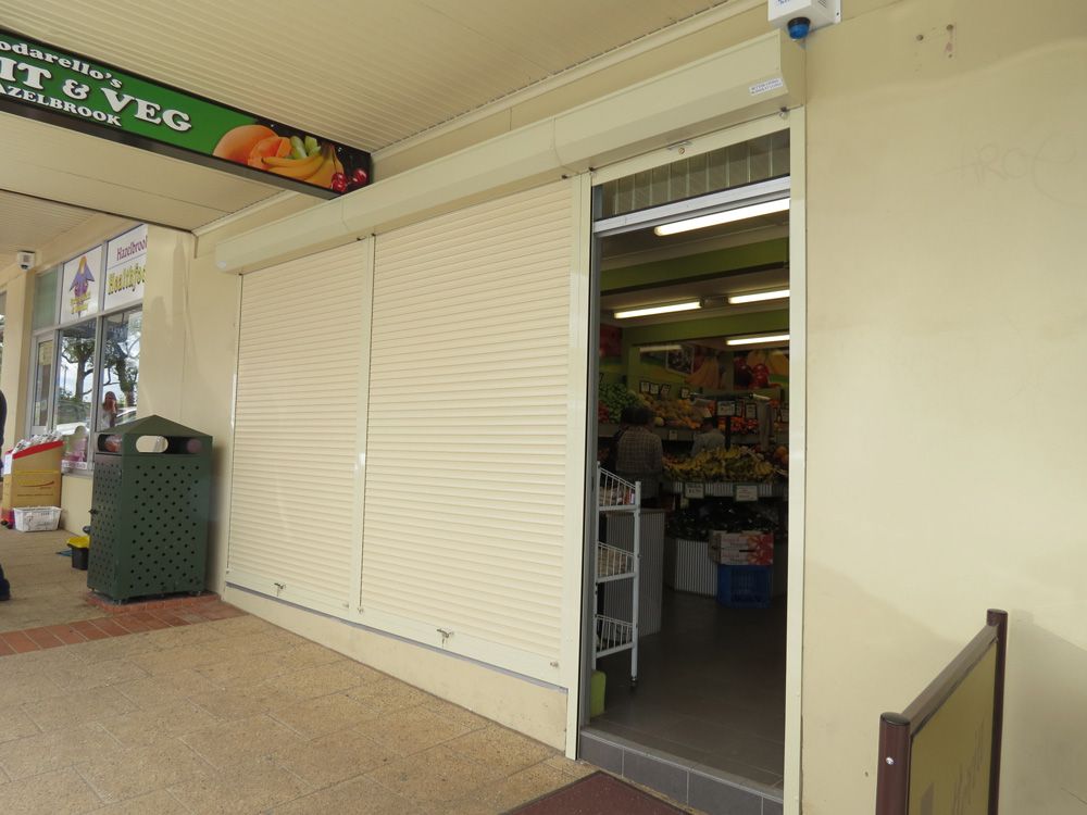 Blue Mountains Partially Opened Roller Shutters — Window Shutters in Wollongong, NSW