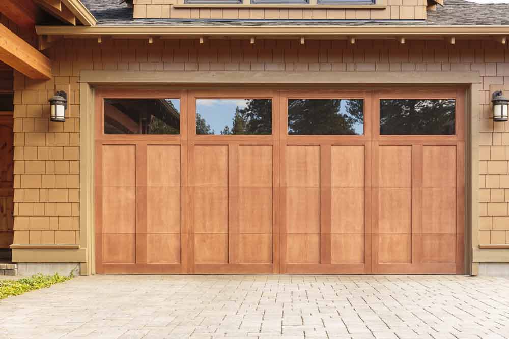 Closed Brown Garage Door With Windows — Garage Doors in Wollongong, NSW