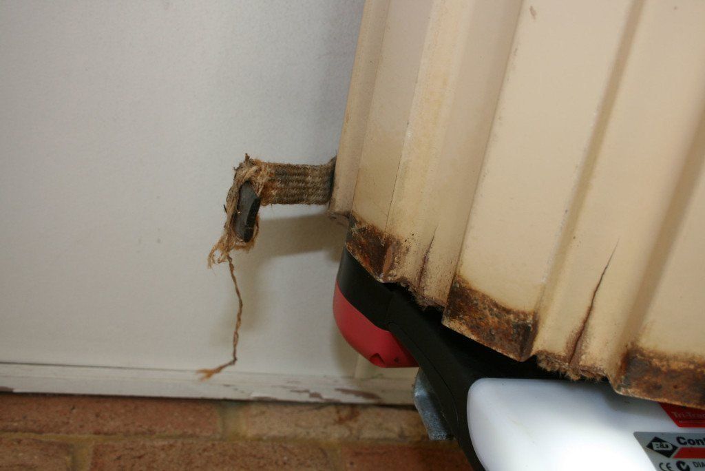 Broken Garage Roller — Garage Door Repairs in Buli, NSW