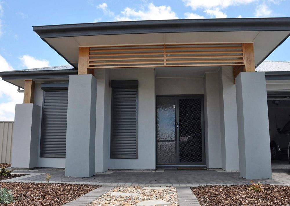Residential House With Window Shutters — Window Shutters in Wollongong, NSW