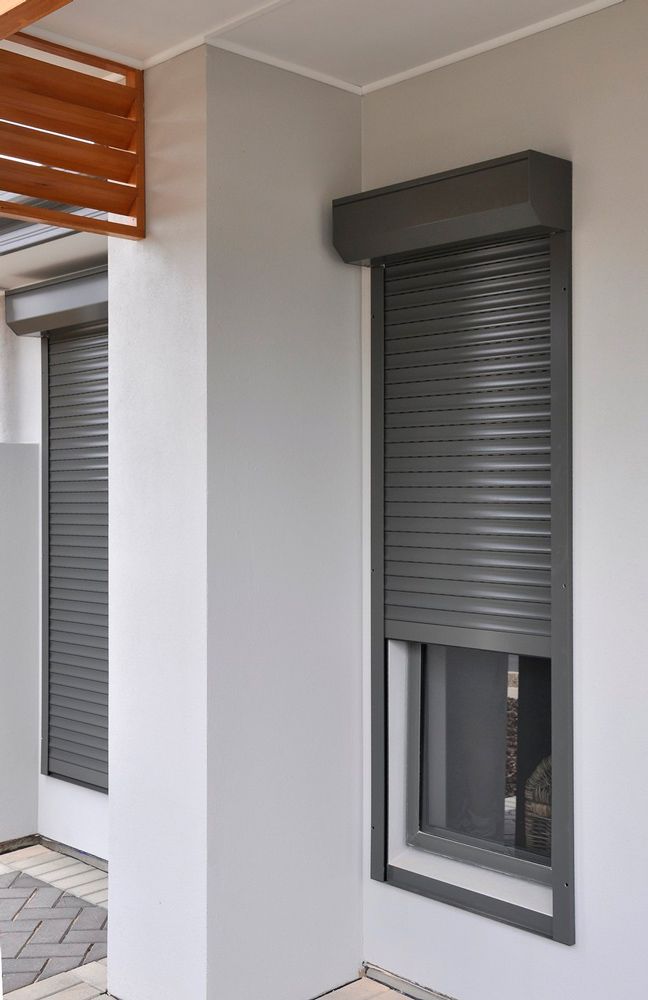 Partially Opened Grey Window Shutters — Window Shutters in Wollongong, NSW