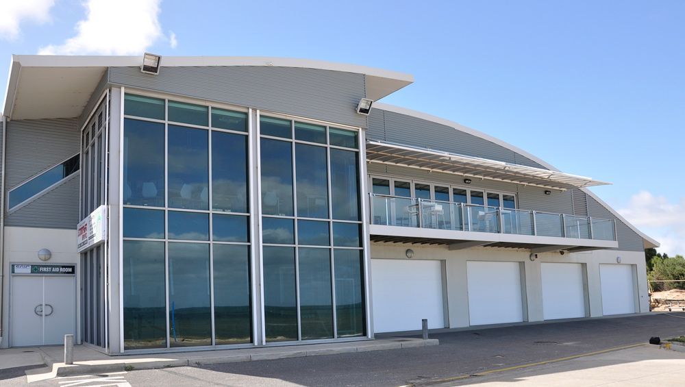 Commercial Building With Glass Panel — Window Shutters in Wollongong, NSW