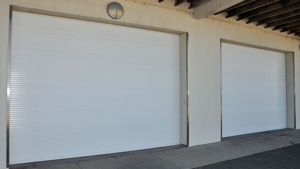 Closed Garage Door Of Building — Window Shutters in Wollongong, NSW