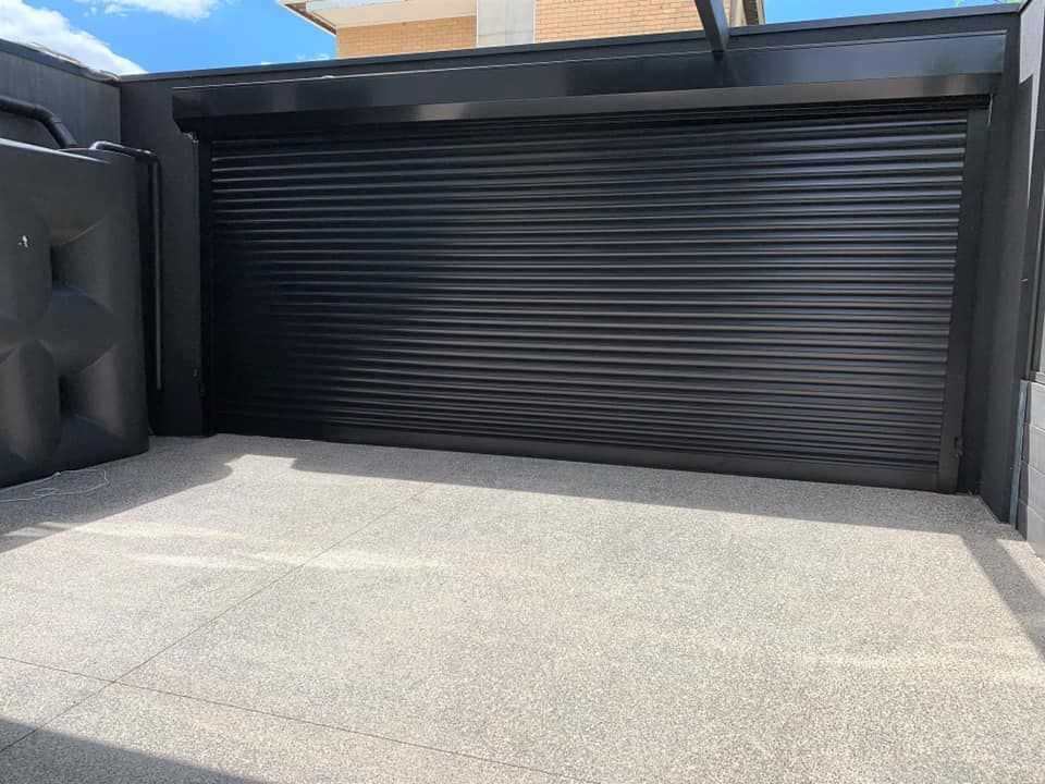 Closed Roller Shutter Of Garage Door — Window Shutters in Wollongong, NSW