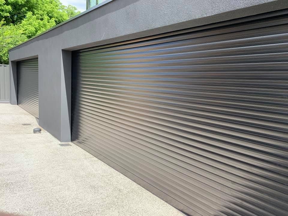 Roller Shutters Of Two Garage Doors — Window Shutters in Wollongong, NSW