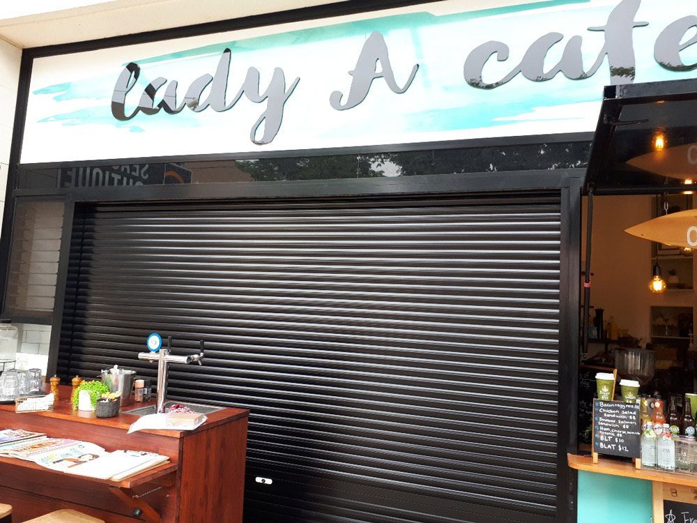 Closed Shutters Of Cafe 2 — Window Shutters in Wollongong, NSW