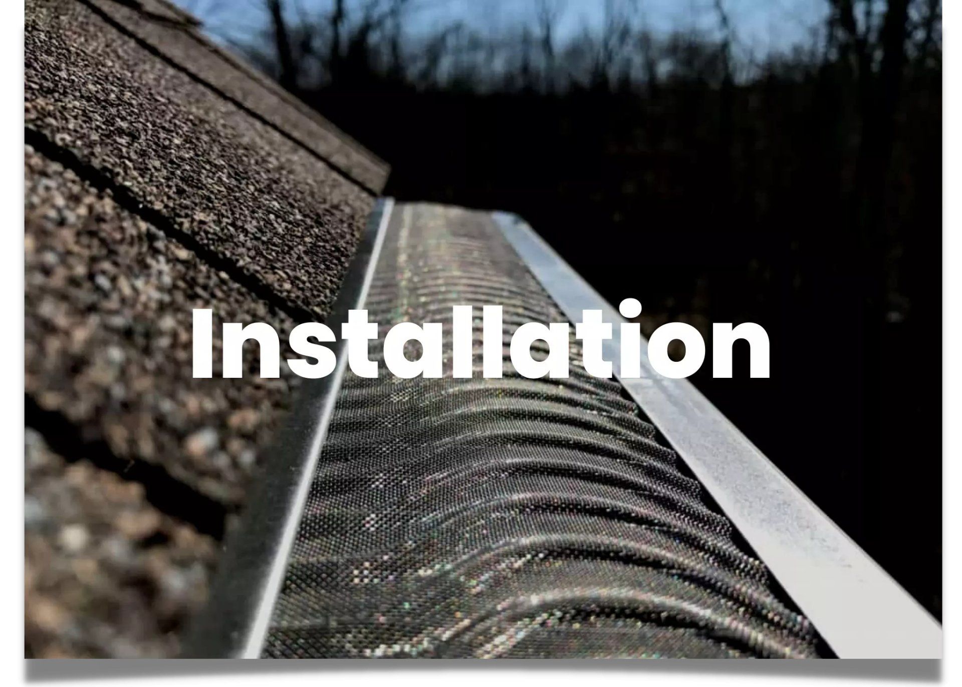 A brand-new gutter system with custom leaf guards we installed.
