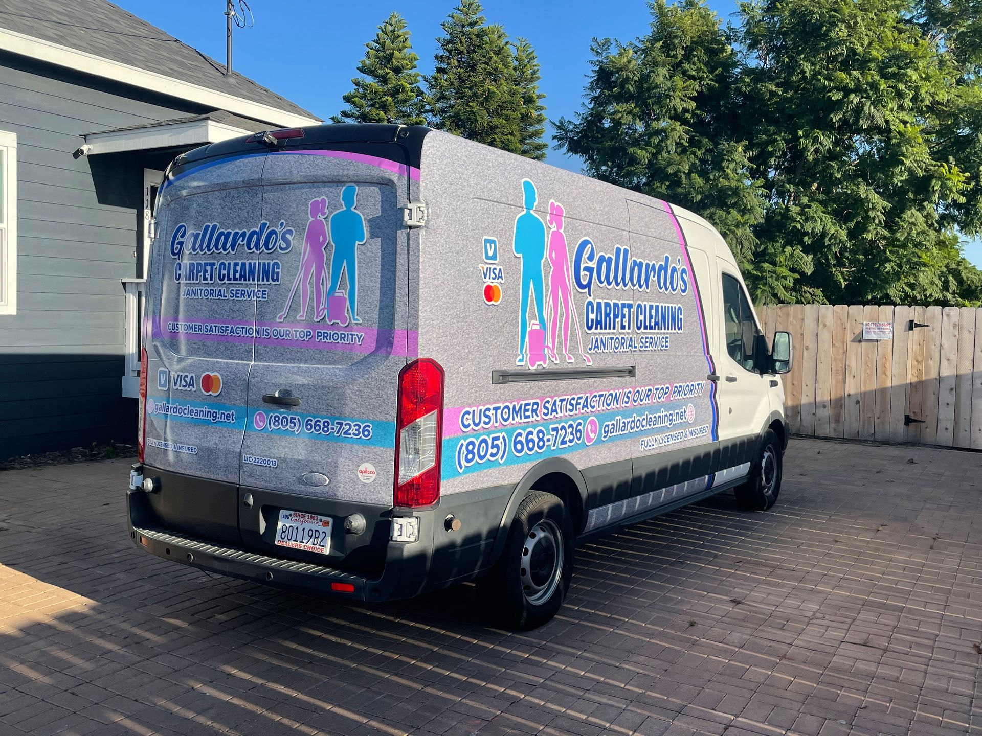A white van is parked in front of a house. residential cleaners near me
