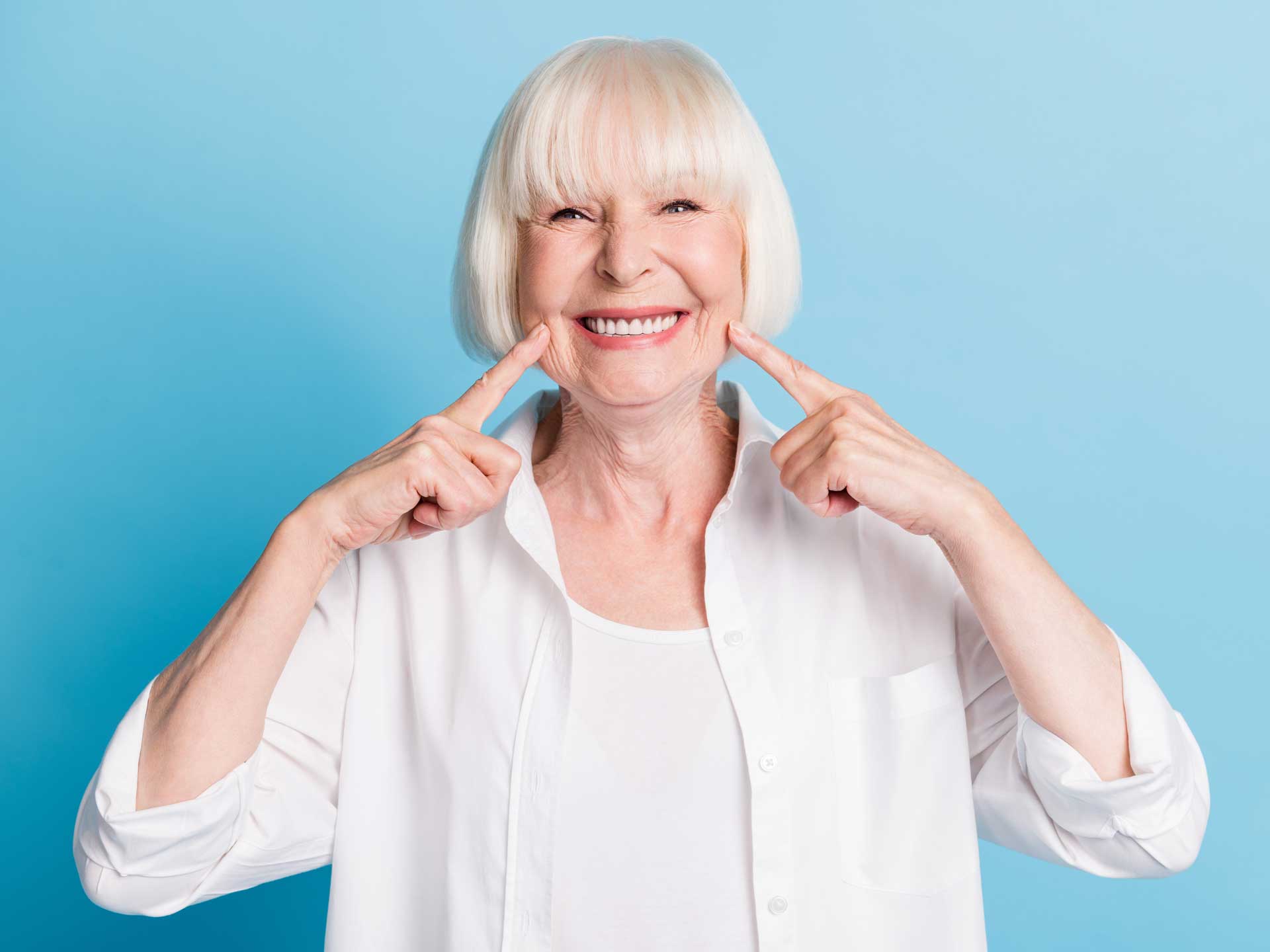 Patient smiling after Dental crowns and bridges procedure