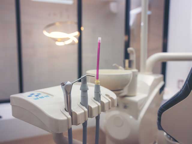 A close up of a dental chair in a dental office.