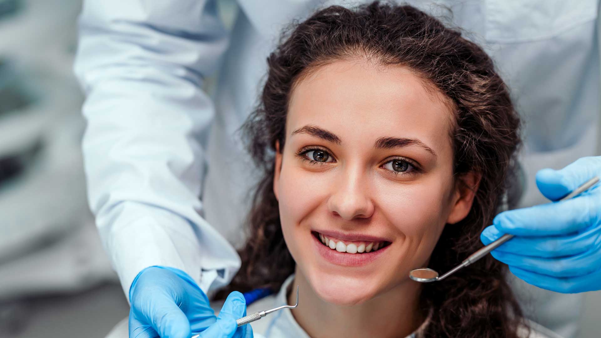 Smiling patient with a restored tooth