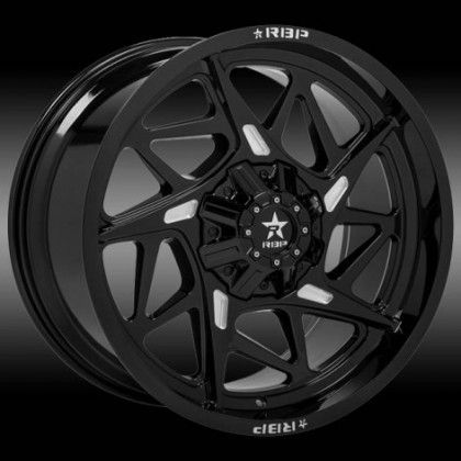 A close up of a black wheel with a white star on it