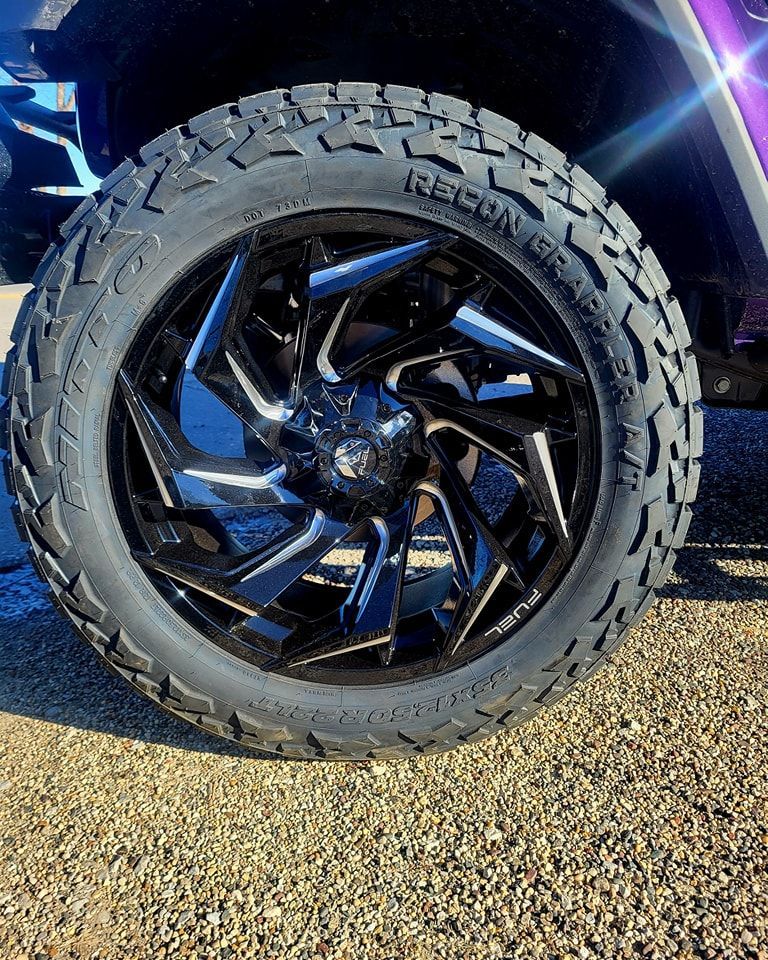 A close up of a tire and wheel on a truck.