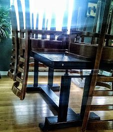 A wooden dining table and chairs in a living room.