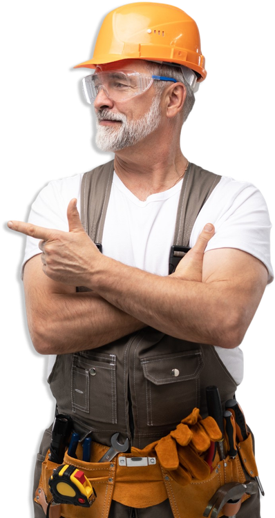 A man wearing a hard hat and goggles is pointing to the side.