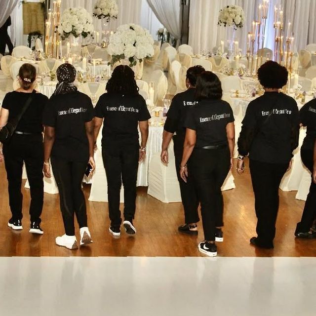 A group of people wearing black shirts with the word i love on them