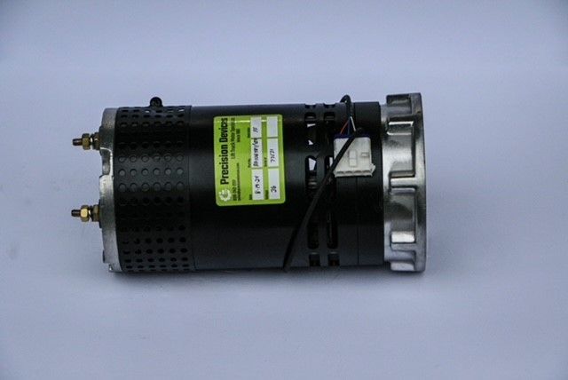 A close up of a motor on a white surface