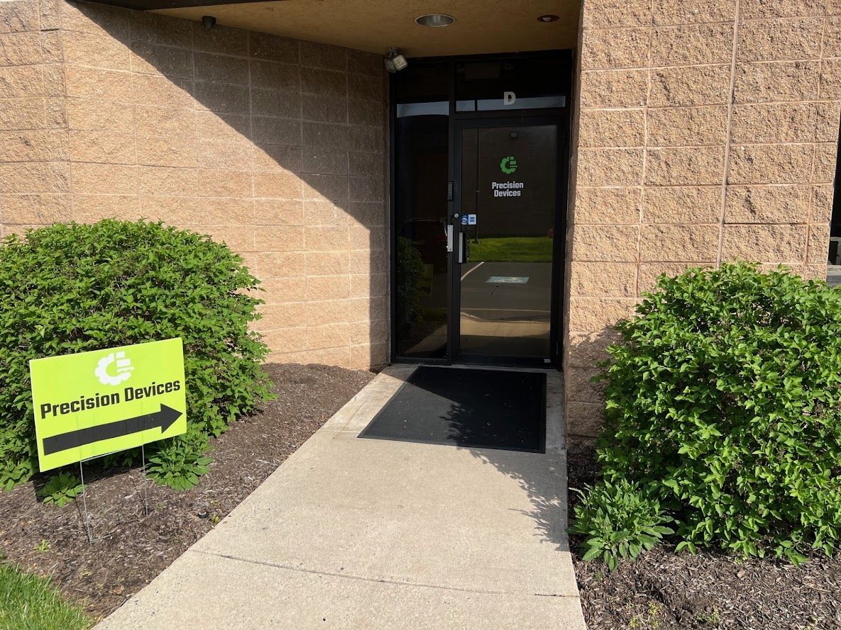 A walkway leading to a building with a sign that says ' franchise division ' on it.