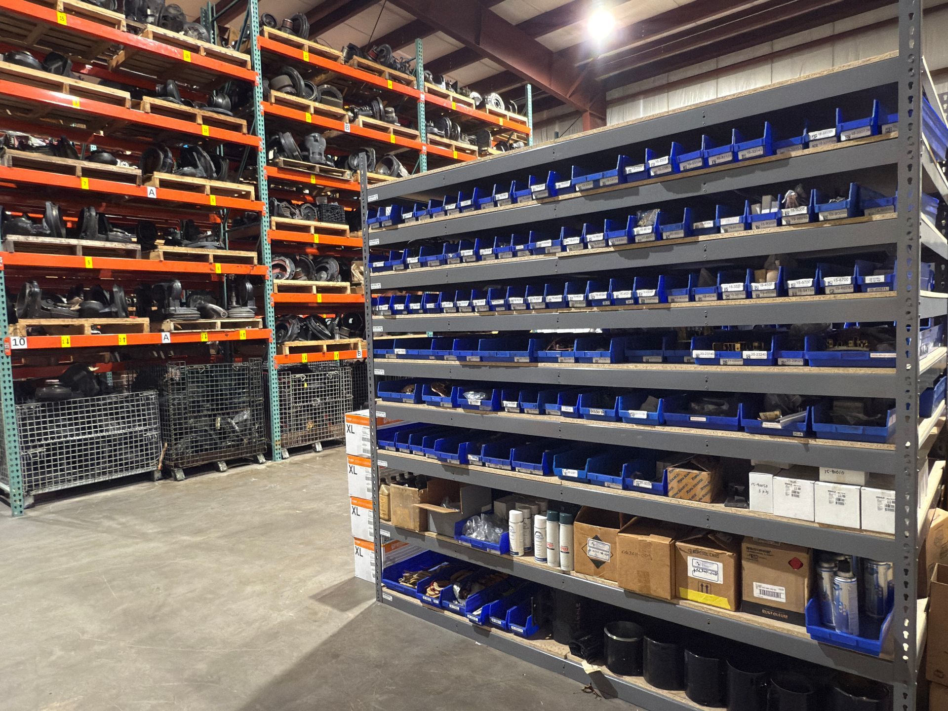 A warehouse filled with lots of shelves and bins