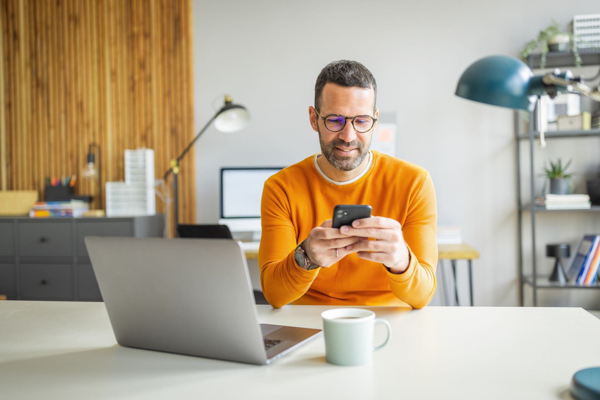 Close-up of ear with hearing aid behind the ear, gray hair.