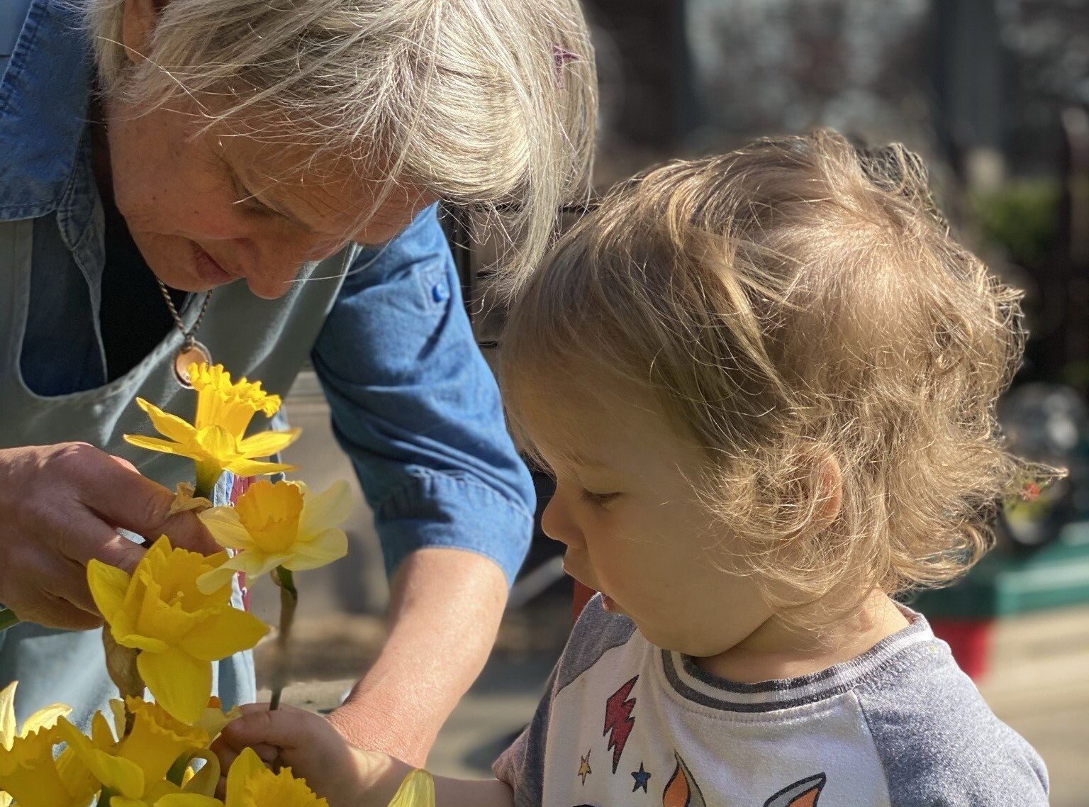 Guide and child working in the garden