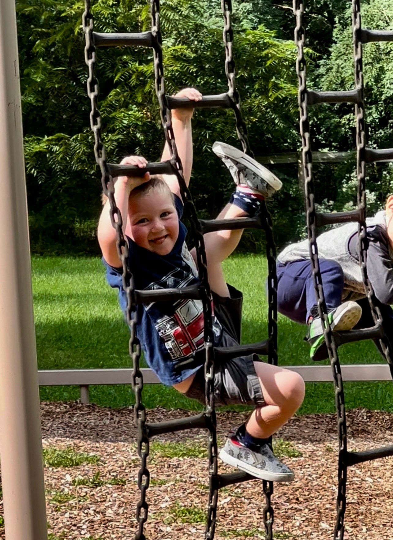 Montessori child is playing outside