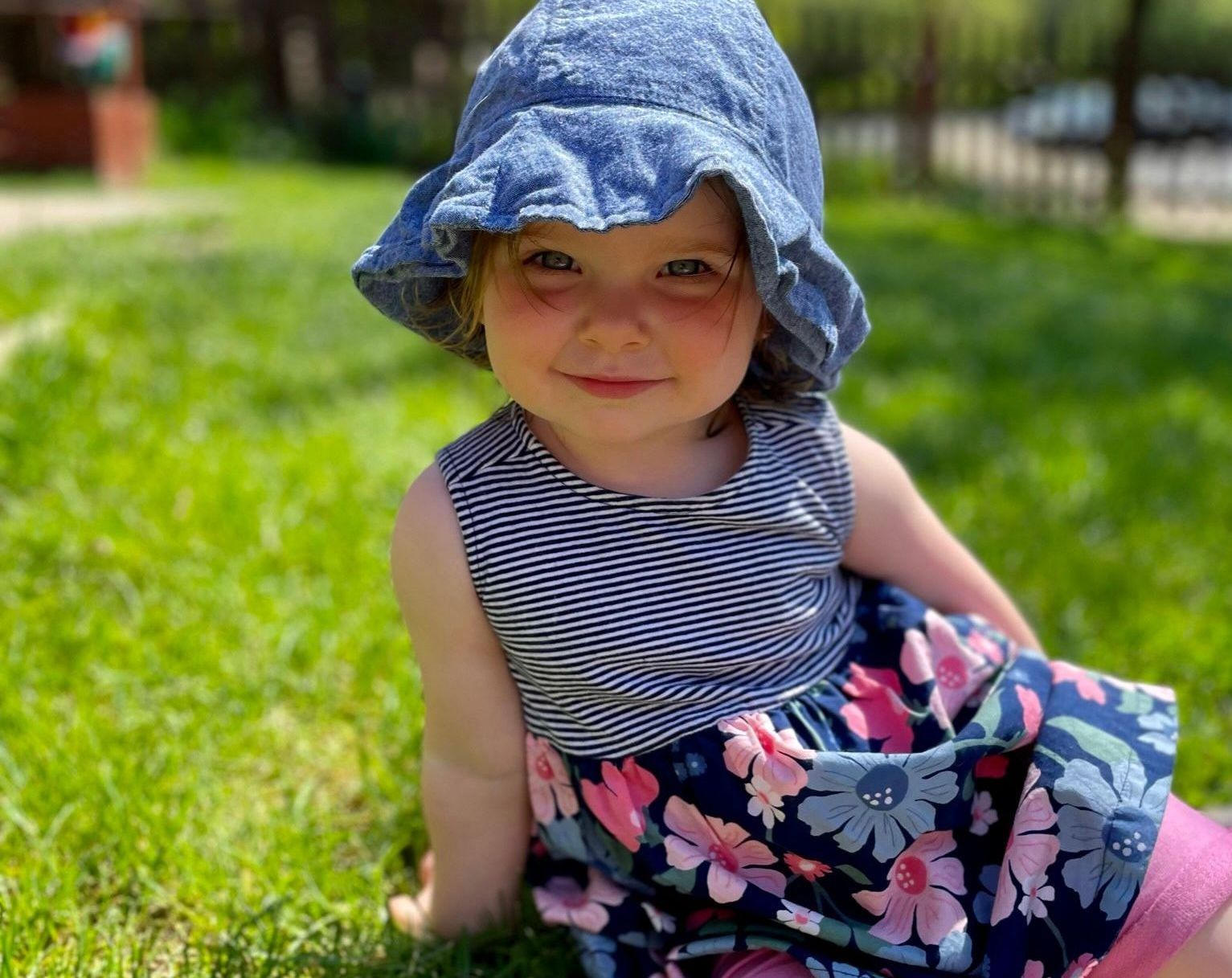 Montessori toddler smiling at the camera