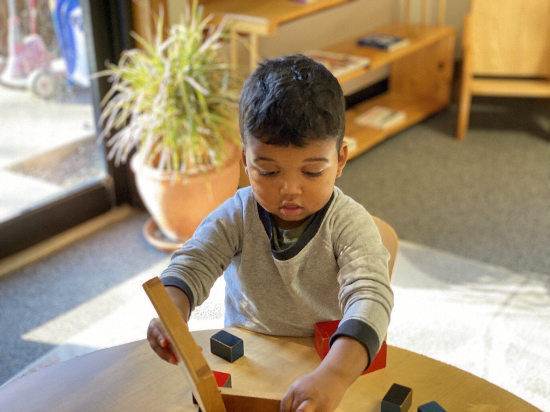 Montessori toddler working in the classroom