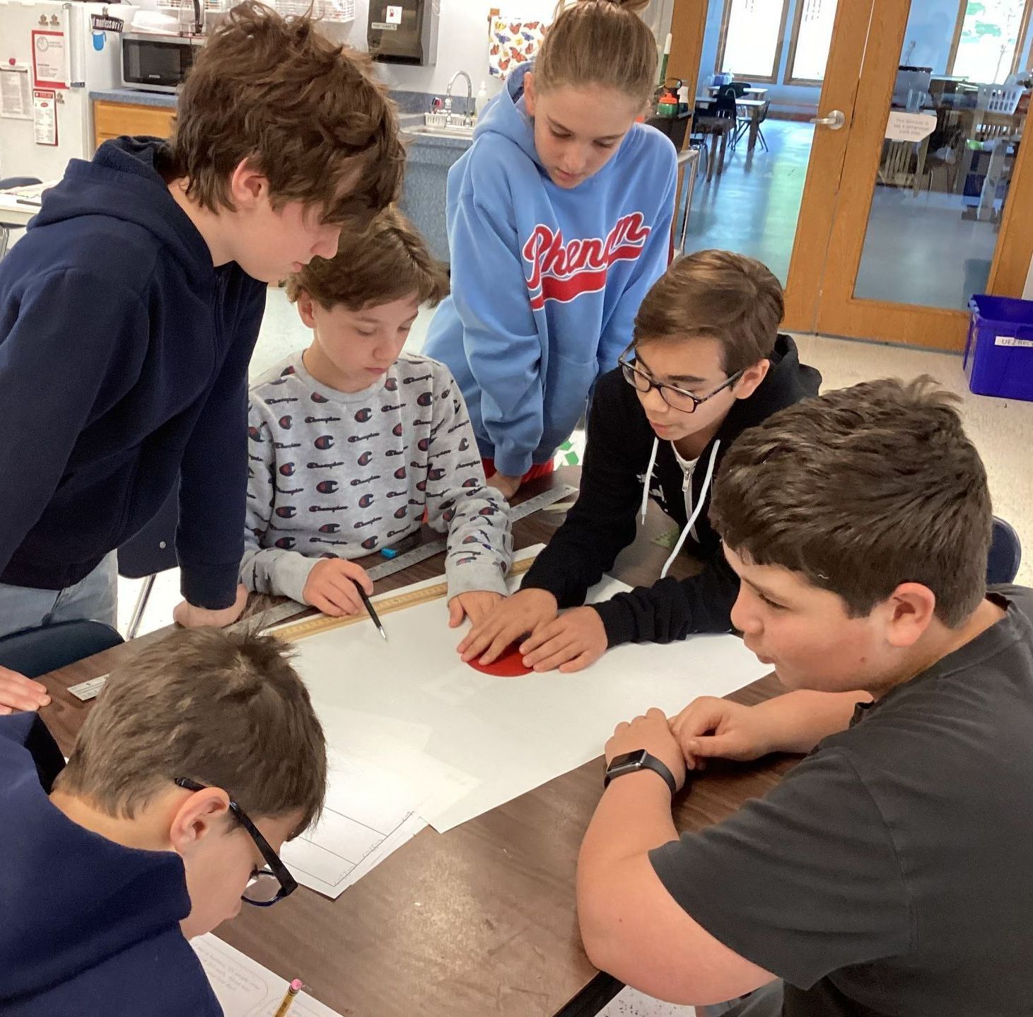 Montessori children working together in the classroom