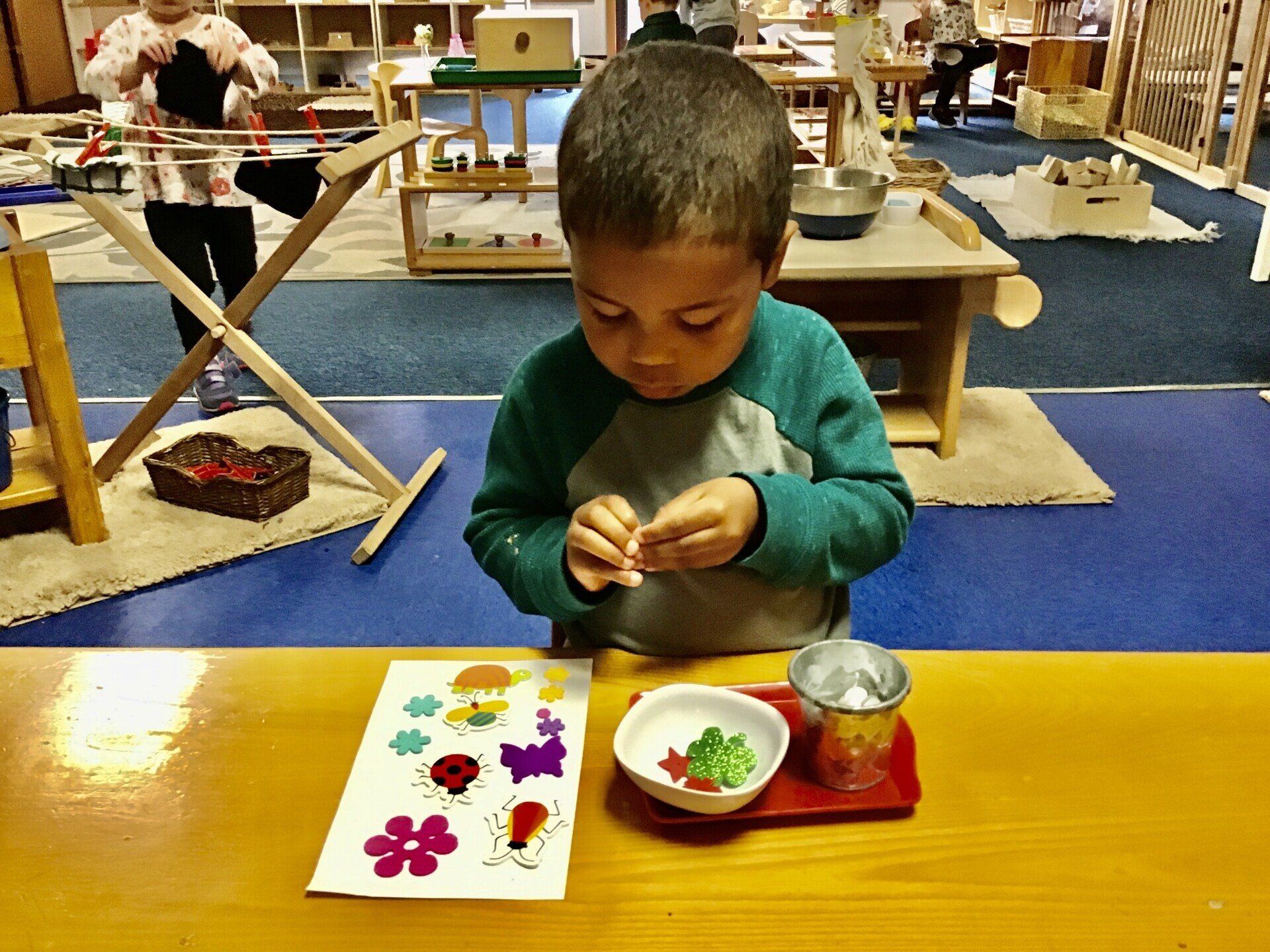Toddler working with Montessori Materials
