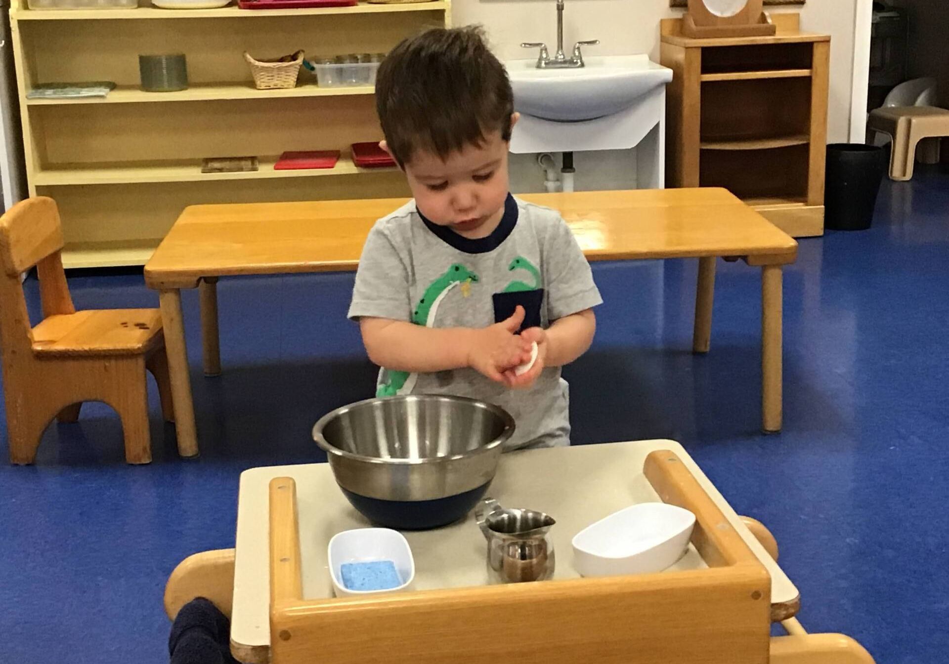 Montessori child working on practical life skills