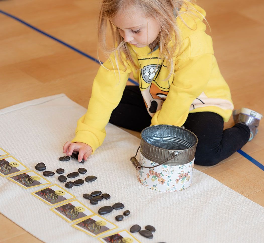 Montessori child working on practical life skills