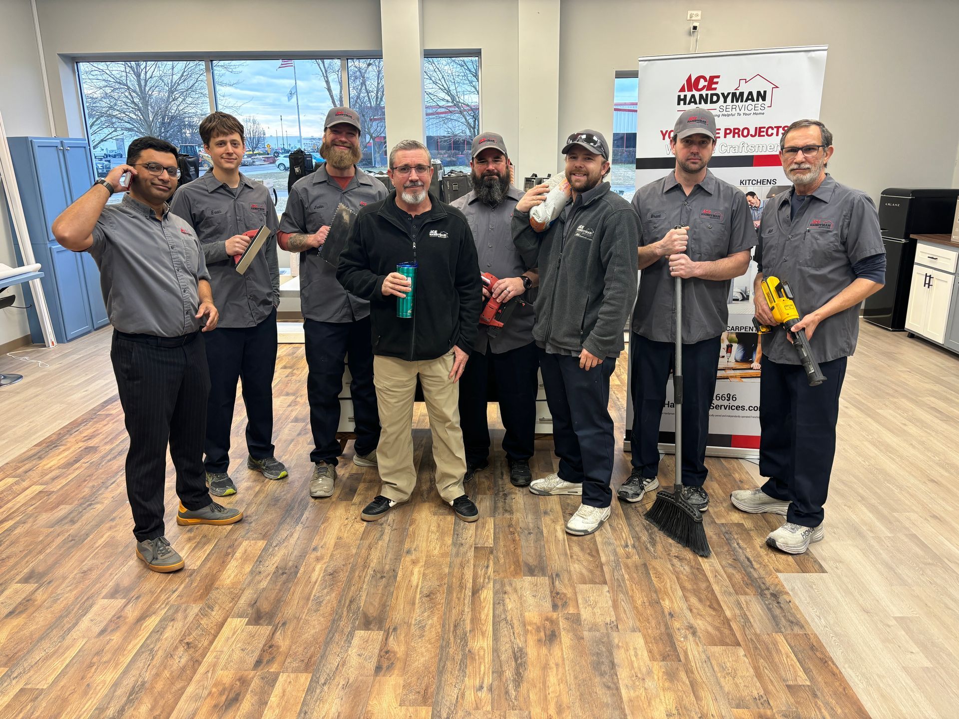 Employees and owner of Ace Handyman services gather for a fun group photo together