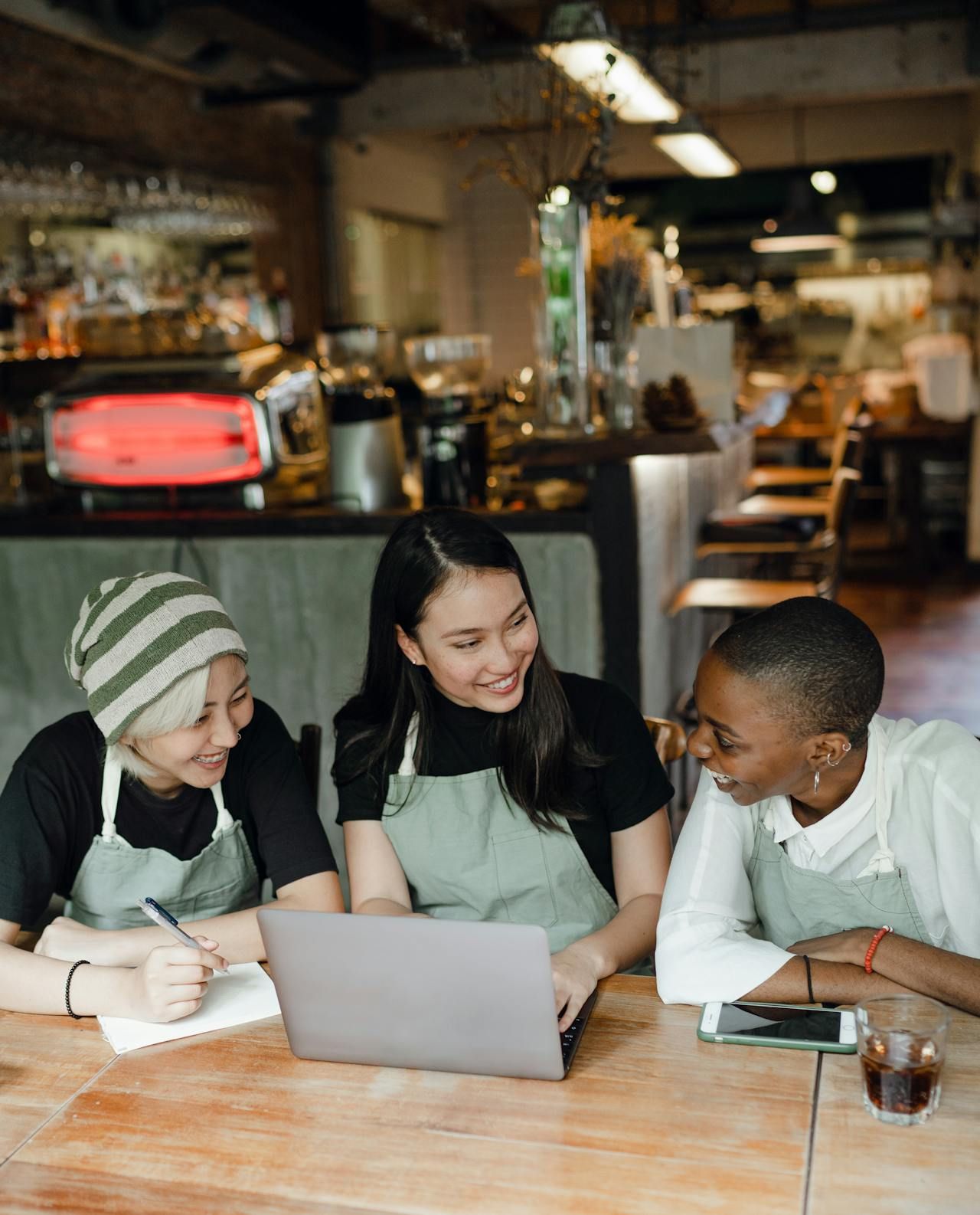 Entrepreneurs weighing the benefits of business ownership in a strategy meeting.