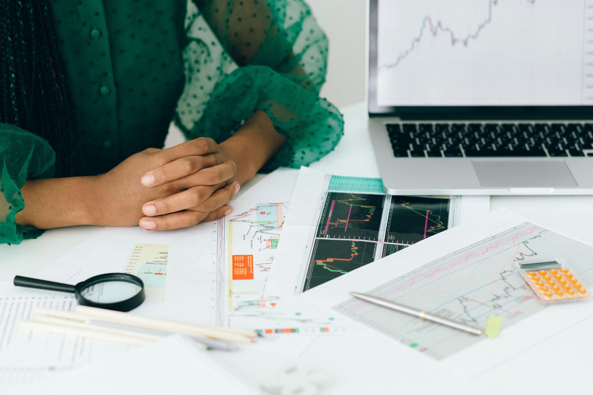 Entrepreneur reviewing franchise business plans and financial documents at a desk.