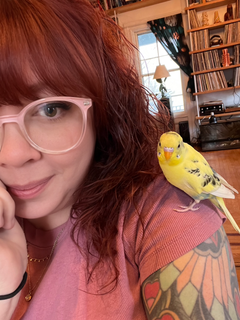 jen with a parakeet