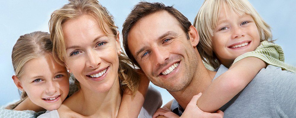 Family of Four Smiling