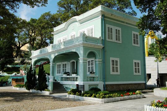 a blue house with white trim and windows