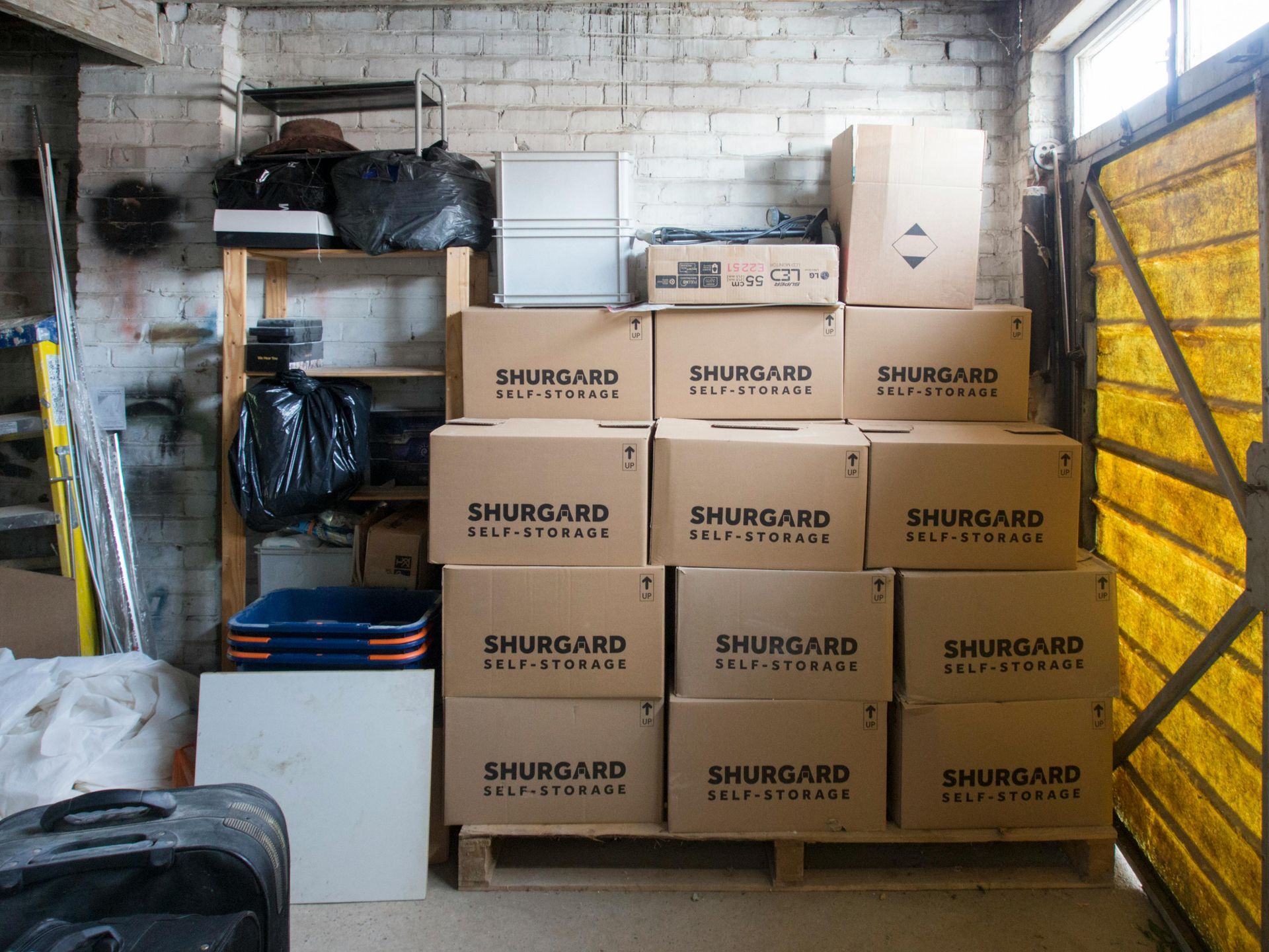 Stacked Shurgard moving boxes for long distance.